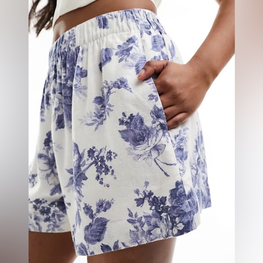 White and blue floral flowy shorts